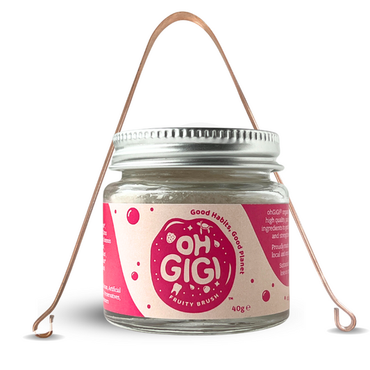 ohGiGi non tox organic toothpowder fruity and tongue scraper front view